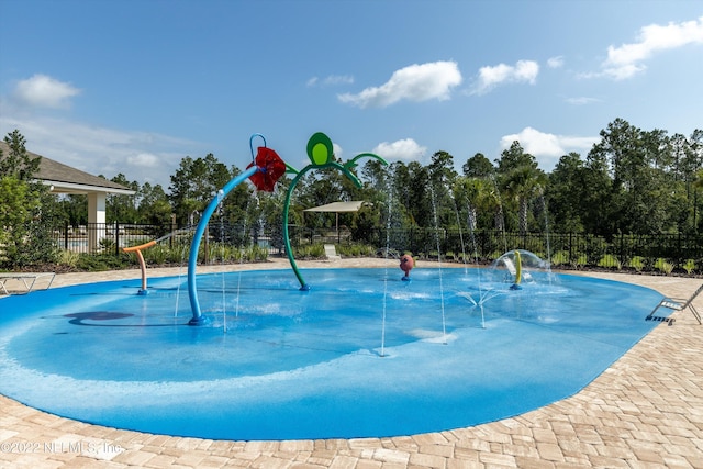 view of pool with fence