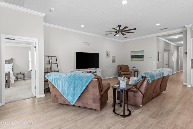 living area with visible vents, baseboards, recessed lighting, light wood-style flooring, and a ceiling fan