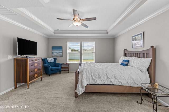 bedroom featuring baseboards, a tray ceiling, and carpet floors