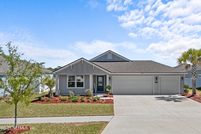 ranch-style house featuring a garage, a front yard, roof with shingles, and driveway