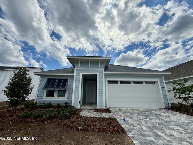 274 Lamego Ln, Saint Augustine, FL 32095 - view of front of home with an attached garage and decorative driveway