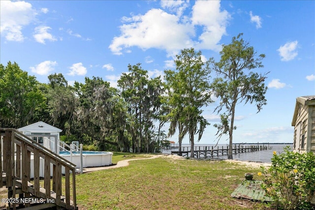 view of yard with an outdoor pool