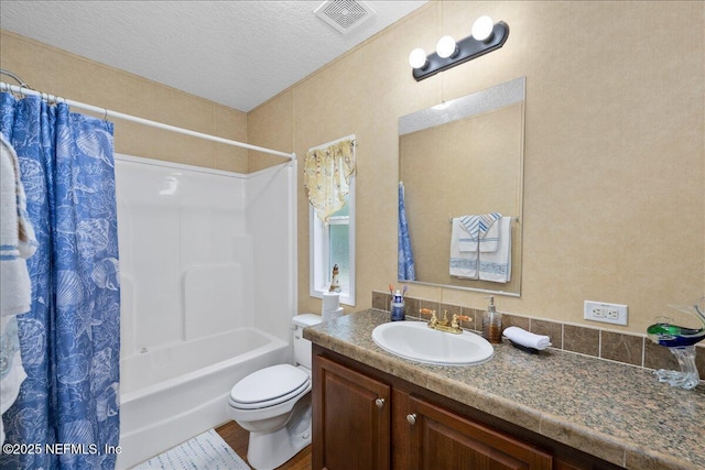 full bathroom with vanity, shower / bathtub combination with curtain, visible vents, a textured ceiling, and toilet