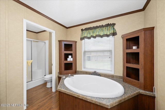 full bath with wood finished floors, a shower stall, toilet, and ornamental molding