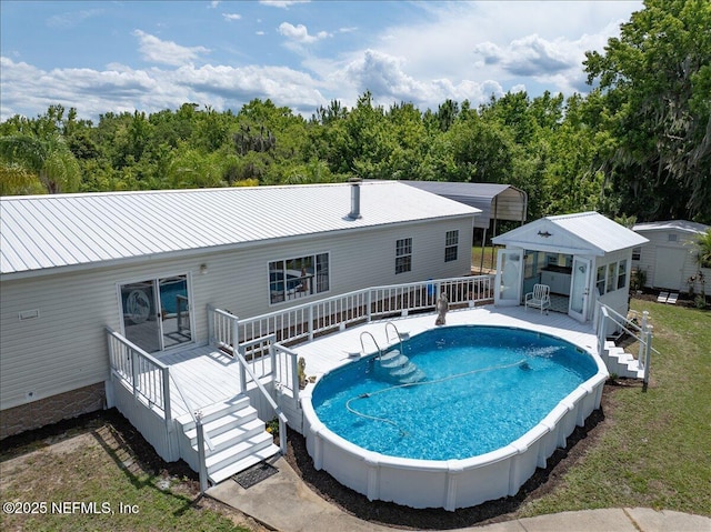 pool featuring stairway and a wooden deck