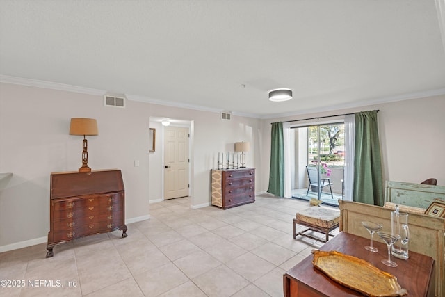 interior space featuring visible vents, crown molding, and baseboards