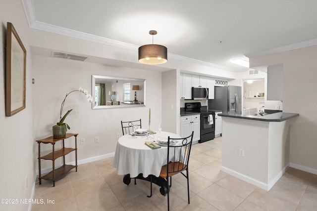 dining area with light tile patterned floors, visible vents, and ornamental molding