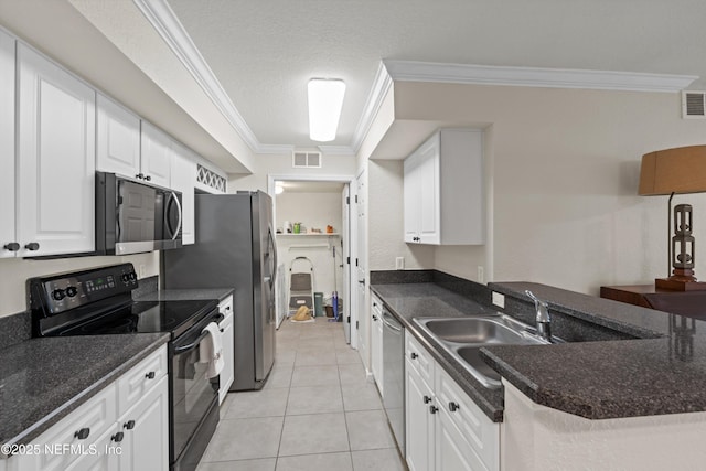 kitchen featuring visible vents, ornamental molding, appliances with stainless steel finishes, white cabinetry, and a sink