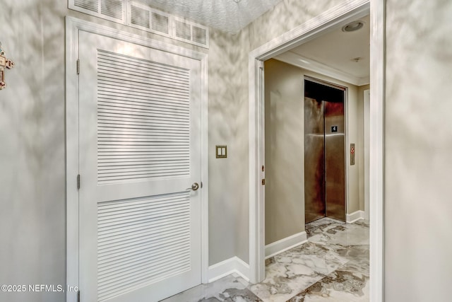 entryway with baseboards, elevator, and marble finish floor