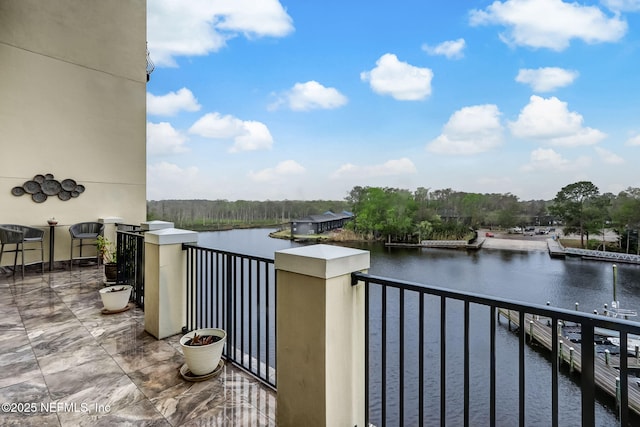 balcony featuring a water view