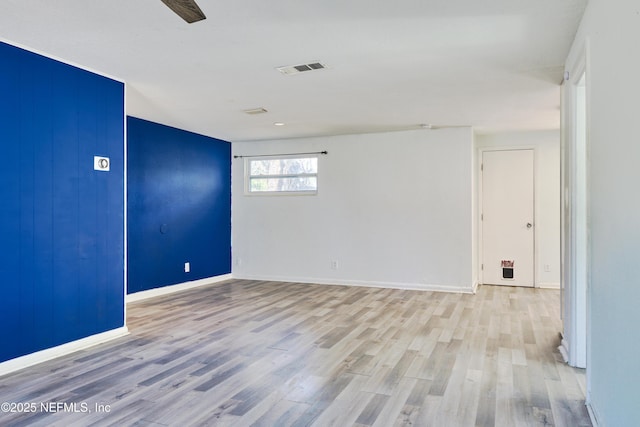 395 Arora Blvd, Orange Park, FL 32073 - spare room with visible vents, wood finished floors, and baseboards