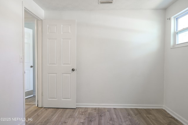 395 Arora Blvd, Orange Park, FL 32073 - unfurnished room with visible vents, baseboards, and wood finished floors