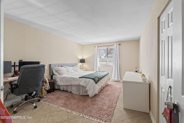 8880 Old Kings Rd S Unit 21, Jacksonville, FL 32257 - bedroom featuring light tile patterned floors and a textured ceiling