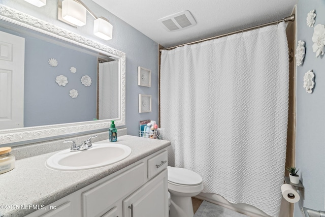 8880 Old Kings Rd S Unit 21, Jacksonville, FL 32257 - full bath featuring a shower with shower curtain, visible vents, toilet, and vanity