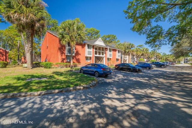8880 Old Kings Rd S Unit 21, Jacksonville, FL 32257 - view of building exterior with uncovered parking