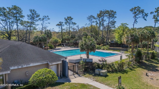 8880 Old Kings Rd S Unit 21, Jacksonville, FL 32257 - community pool with a patio area, a lawn, and fence