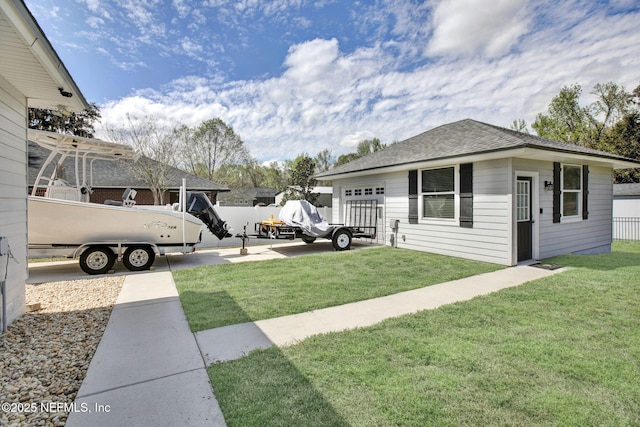 view of yard with an outdoor structure and fence