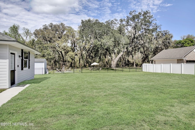 view of yard featuring fence