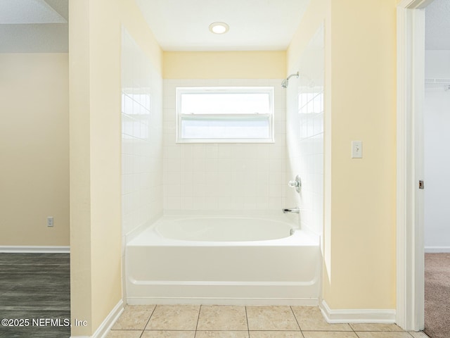 full bath with tile patterned floors, shower / bath combination, and baseboards