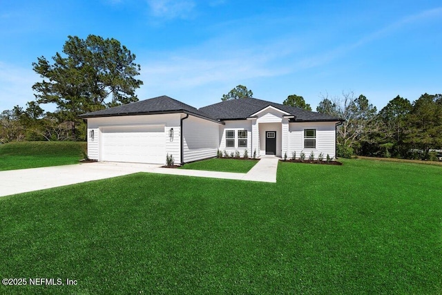 single story home featuring a front lawn, an attached garage, and driveway