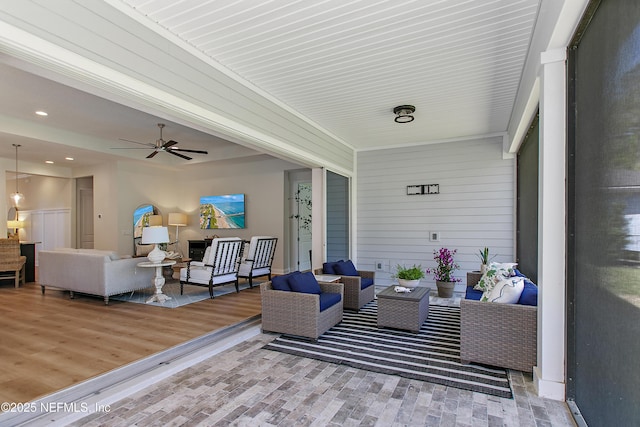 exterior space with outdoor lounge area and a ceiling fan