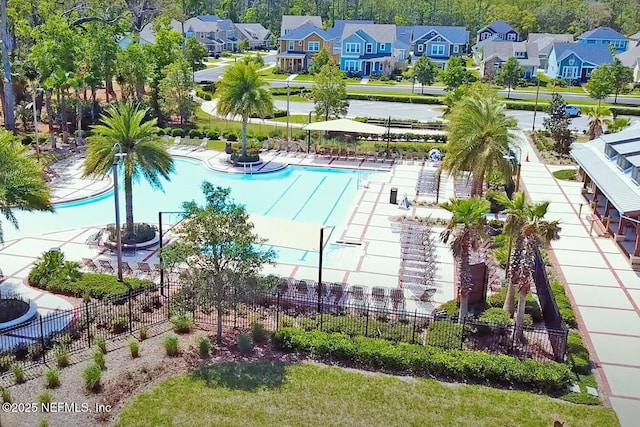 birds eye view of property with a residential view