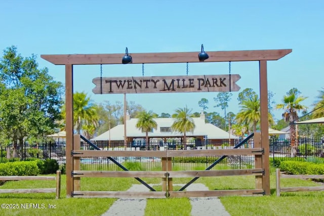 community sign featuring fence