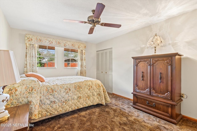 carpeted bedroom with a closet, a ceiling fan, and baseboards