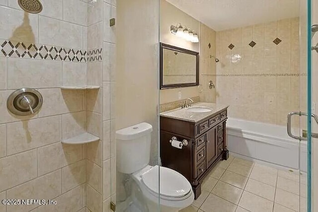 full bath featuring tile patterned flooring, toilet, vanity, and  shower combination