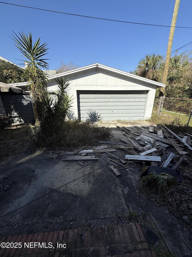 garage featuring fence