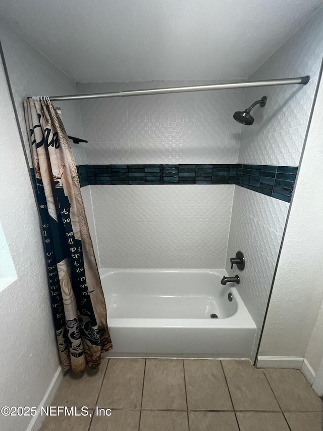 full bath with tile patterned flooring and shower / tub combo