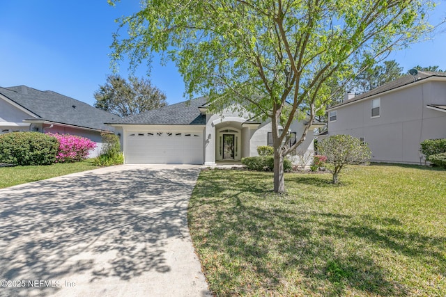 view of front of home with driveway, a front lawn, a garage, and a shingled roof