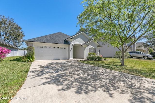 single story home with a front yard, stucco siding, a shingled roof, concrete driveway, and a garage