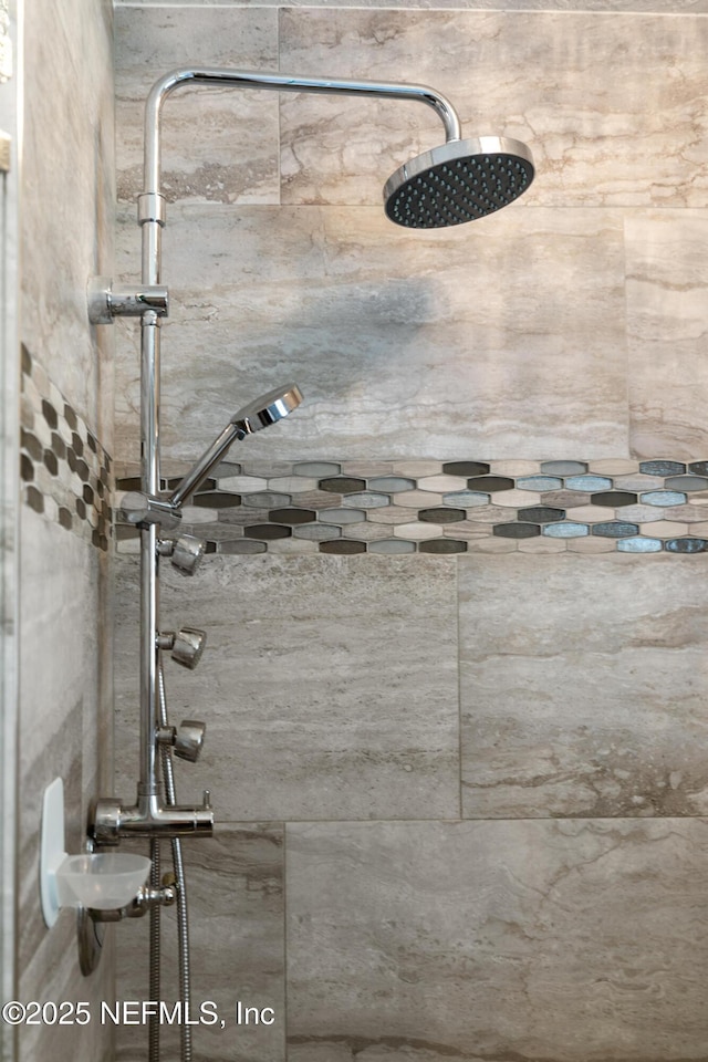 interior space with tiled shower