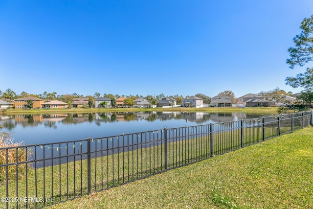 water view featuring a residential view and a fenced backyard