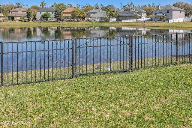 water view featuring a residential view and fence