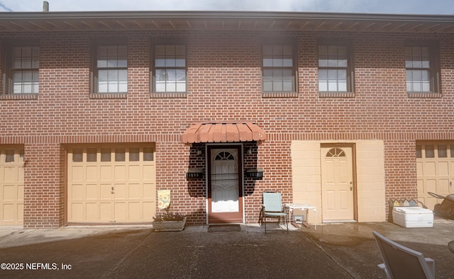 view of property with brick siding