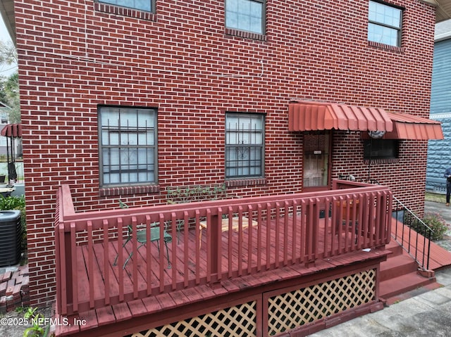 wooden terrace featuring central AC unit