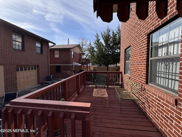 wooden deck with cooling unit and fence