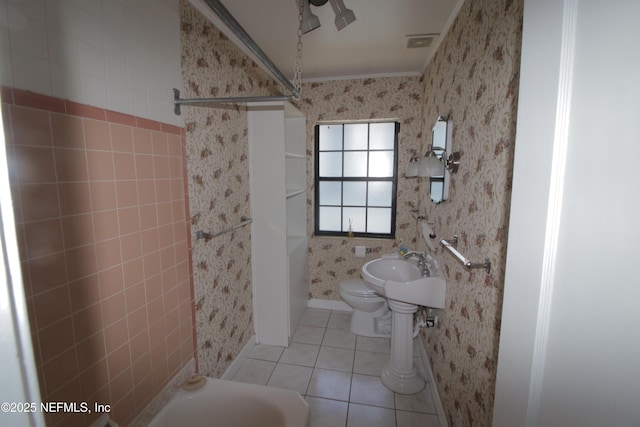 full bathroom featuring tile patterned floors, visible vents, toilet, wallpapered walls, and a shower