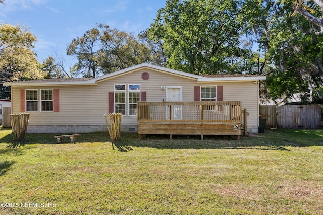 view of front of home featuring crawl space, a wooden deck, a front yard, and fence