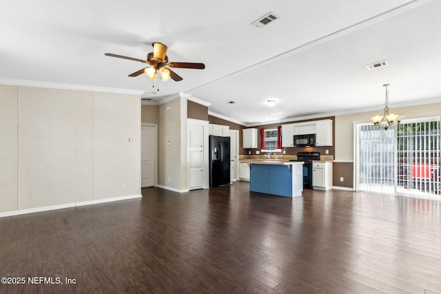 unfurnished living room with dark wood finished floors, visible vents, ceiling fan with notable chandelier, and crown molding