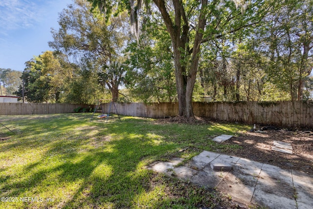 view of yard with a fenced backyard