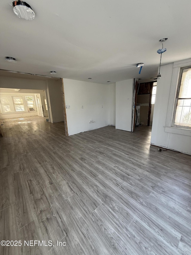 unfurnished living room featuring wood finished floors