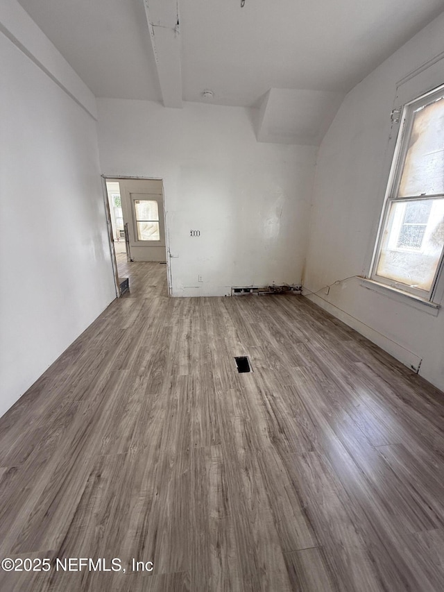 spare room with wood finished floors