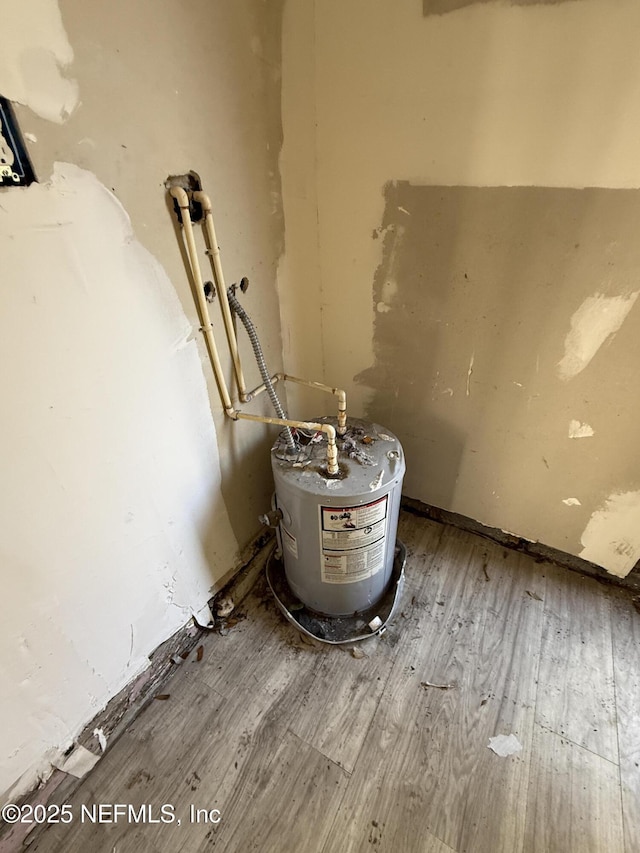 interior details with wood finished floors and water heater