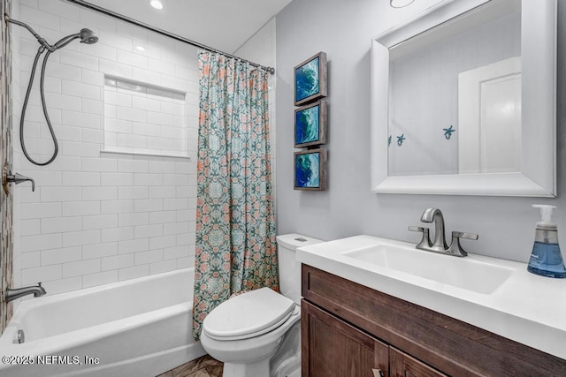 full bath featuring vanity, shower / bath combination with curtain, and toilet