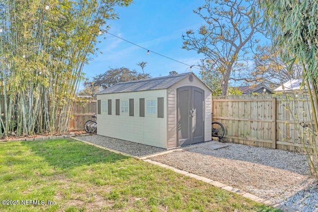 view of shed featuring a fenced backyard