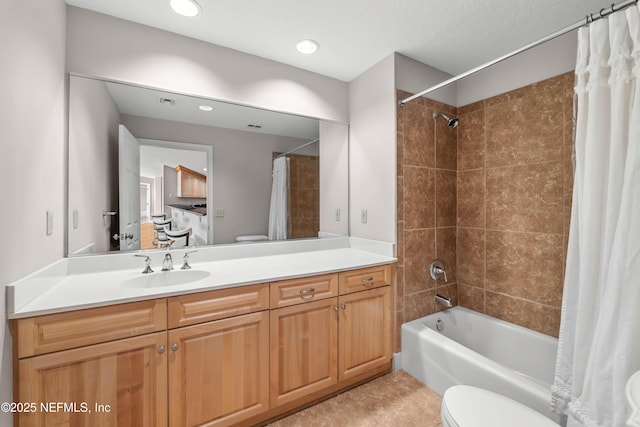 bathroom featuring recessed lighting, vanity, toilet, and shower / tub combo with curtain