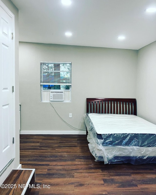 bedroom featuring recessed lighting, wood finished floors, and baseboards